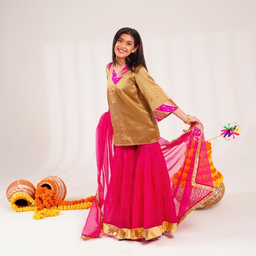 Elegant golden brocade kurti with organza dupatta and pink sharara kids festive wear India