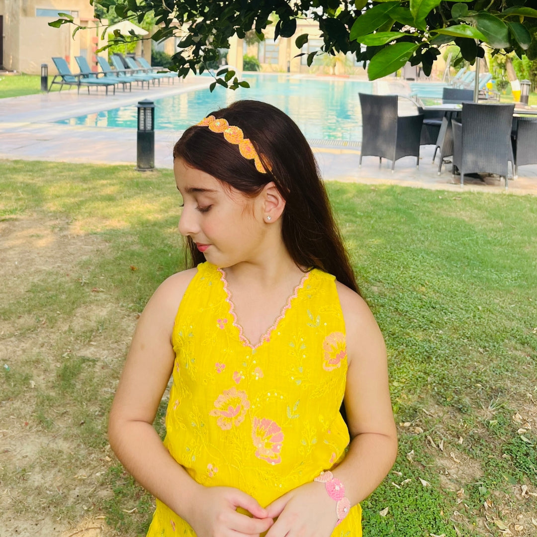 Yellow-orange sequin headpiece for girls, handmade accessory for celebrations in Pune Koregaon Park.