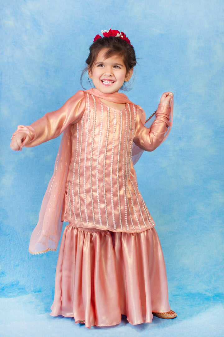 Designer kidswear in scarlet red – premium sharara suit for wedding celebrations in UAE and Singapore.