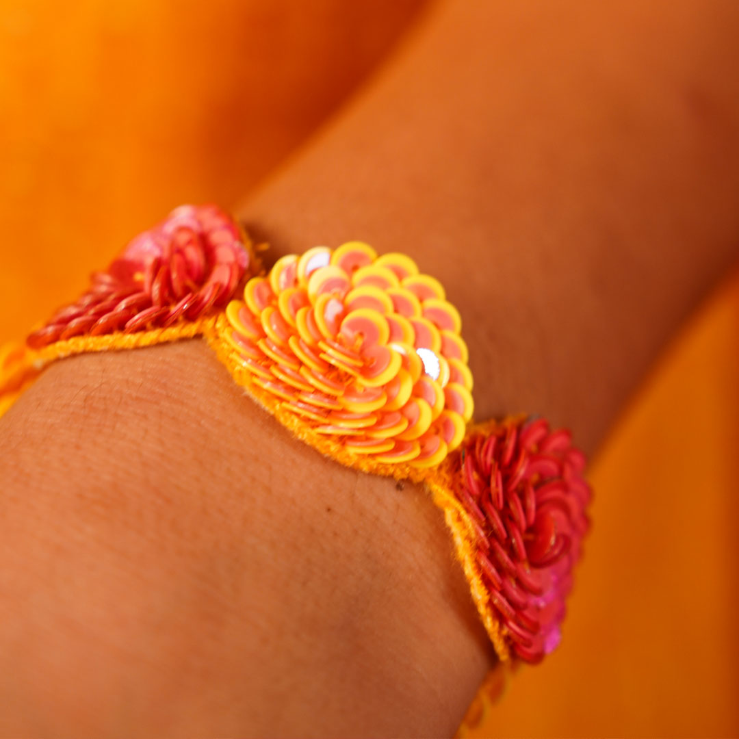 “Celebrate traditions in style with this handmade floral bracelet – lightweight, elegant, and ideal for festive outfits.”