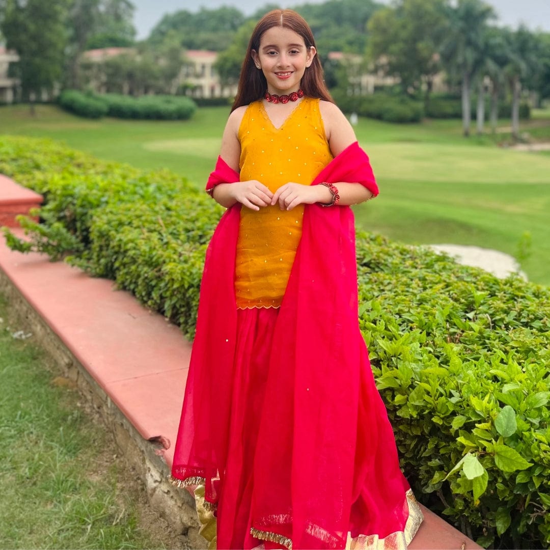 Exclusive yellow and pink kids sharara outfit, ideal for weddings and parties in Delhi, UAE, and Singapore.