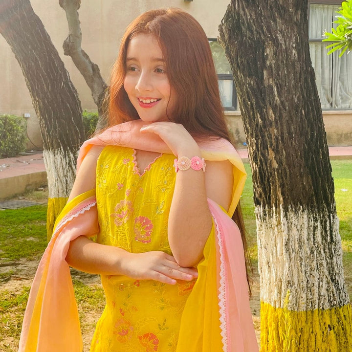 Festive sharara dress for girls in yellow and pink hues, ideal for Haldi events in Gurgaon and Singapore.
