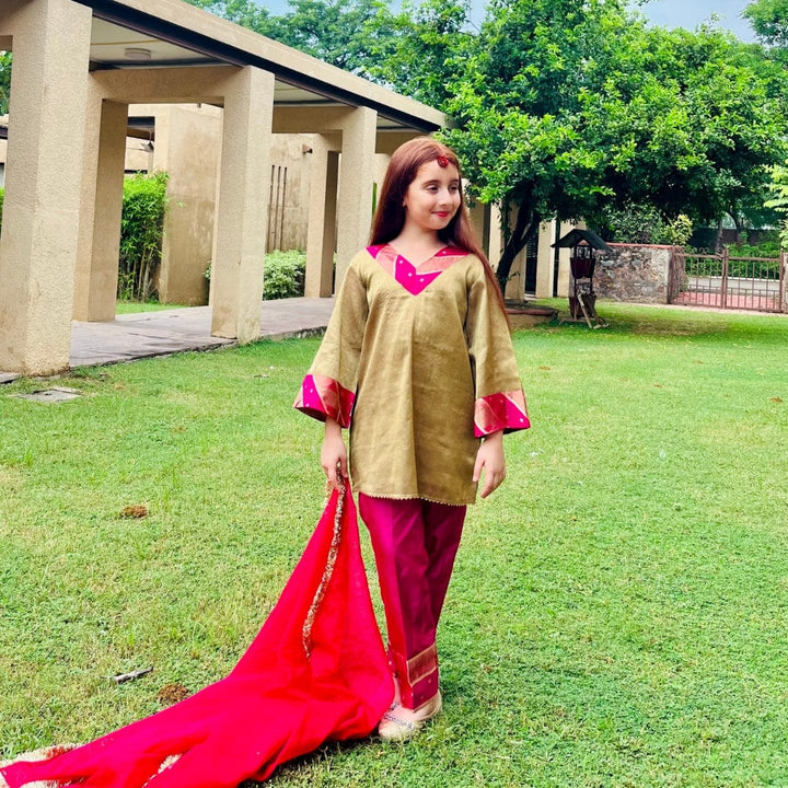 Girls wedding outfit in golden and pink for haldi ceremony in Singapore