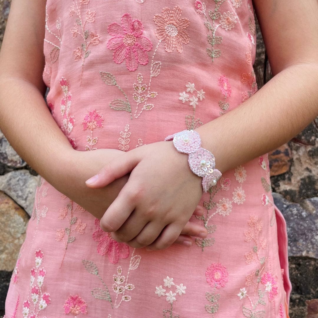 "Luxury pink sequin hand bracelet for girls, artisan-made with easy fast-closing and no irritation, perfect festive accessory with ethnic wear for weddings and Diwali – styled in Gurgaon posh venue."