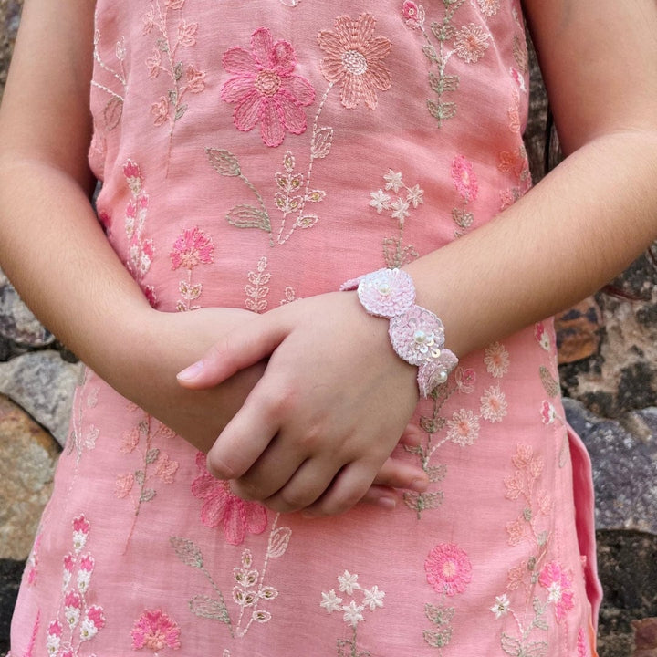 "Luxury pink sequin hand bracelet for girls, artisan-made with easy fast-closing and no irritation, perfect festive accessory with ethnic wear for weddings and Diwali – styled in Gurgaon posh venue."