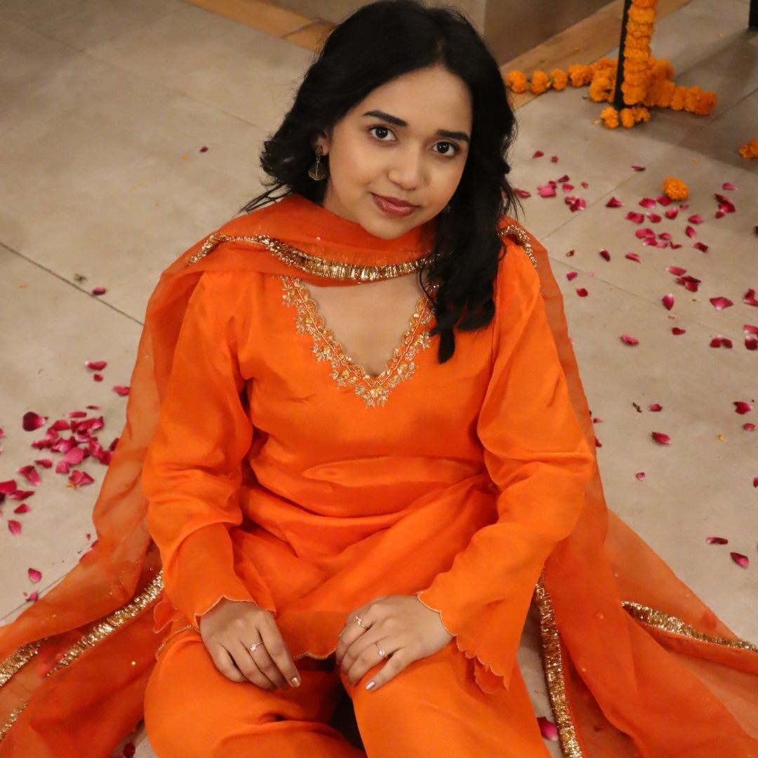 Hyderabad wedding guest orange traditional suit