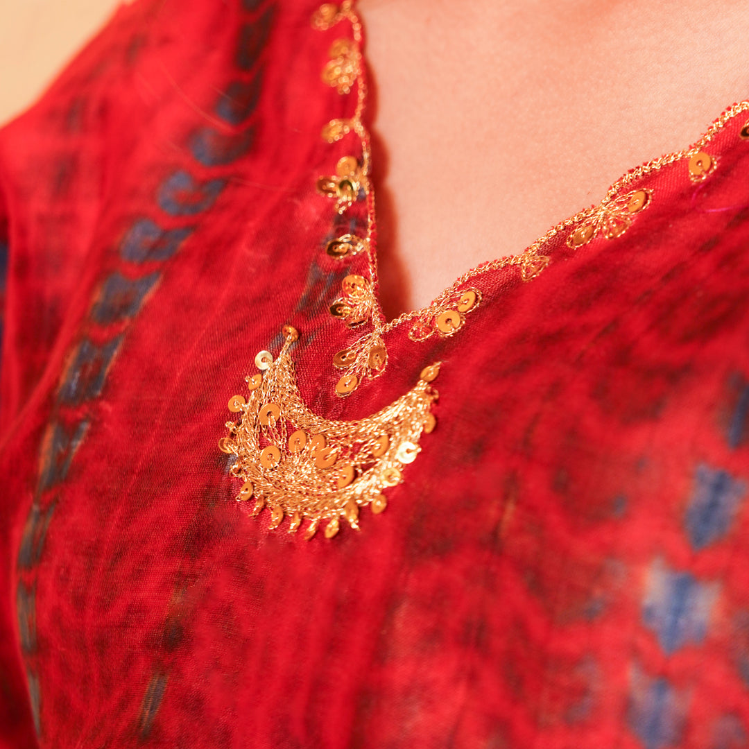 Onam traditional kaftan pants set for girls in wine and indigo with artisanal golden zari