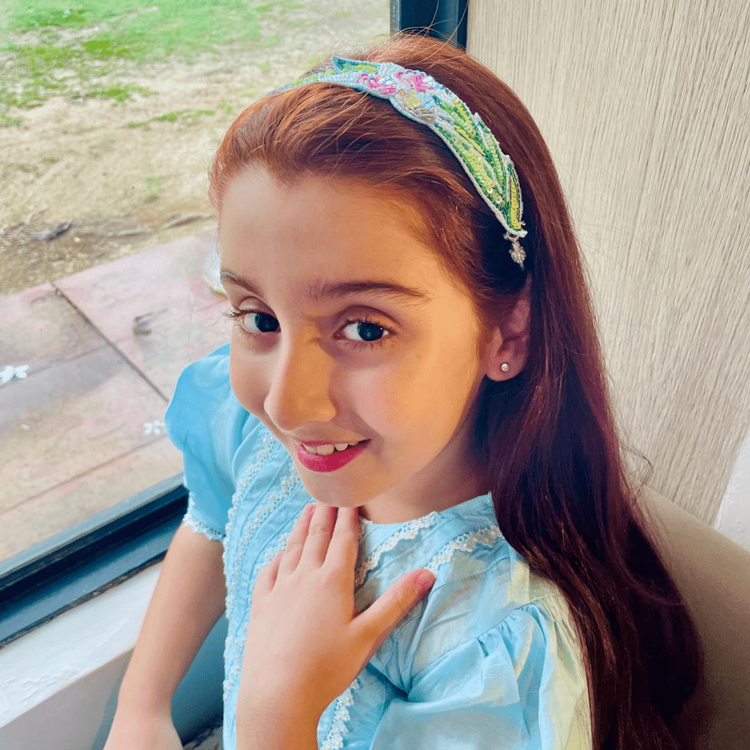 Handmade floral head accessory in pink, aqua, and white, no-itch design for girls’ ethnic and party outfits.