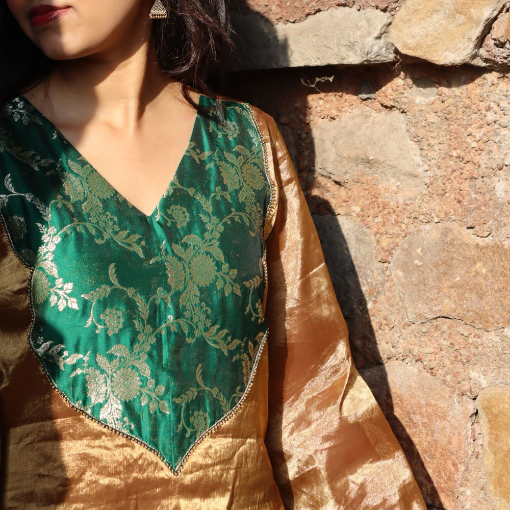 Pure golden tissue ethnic wear for girls with green sharara in UAE celebrations