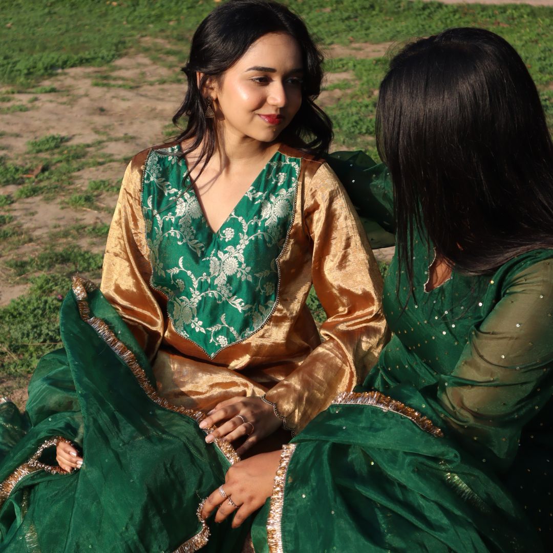 Pure golden tissue kurta with green sharara set for girls for Delhi weddings