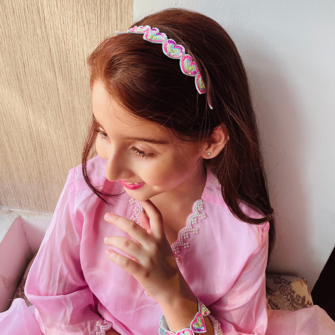 Heart-shaped rainbow hair accessory, lightweight and comfortable, ideal for pairing with lehengas, salwar suits, and shararas.