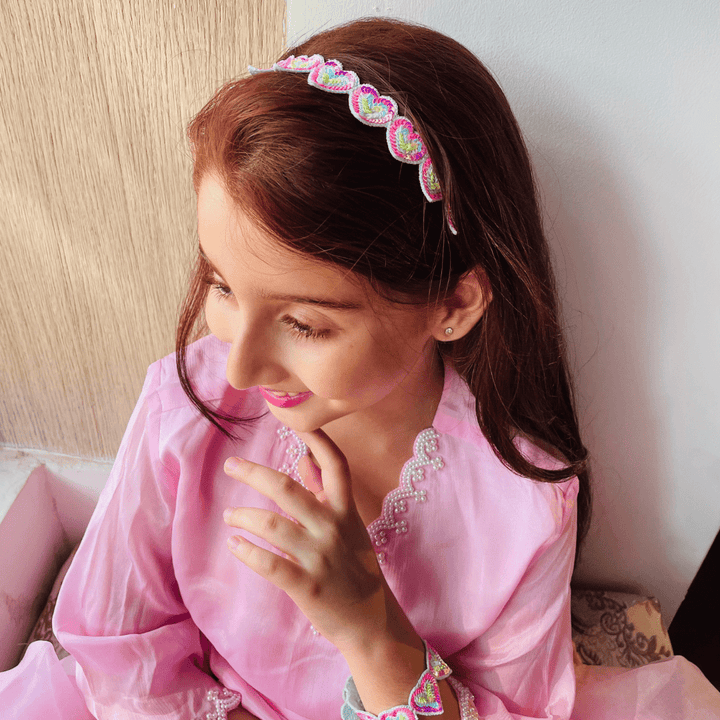 Heart-shaped rainbow hair accessory, lightweight and comfortable, ideal for pairing with lehengas, salwar suits, and shararas.