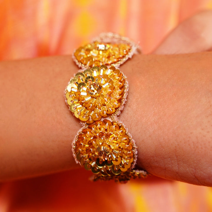 Festive golden bracelet for girls crafted by artisans in India worn worldwide