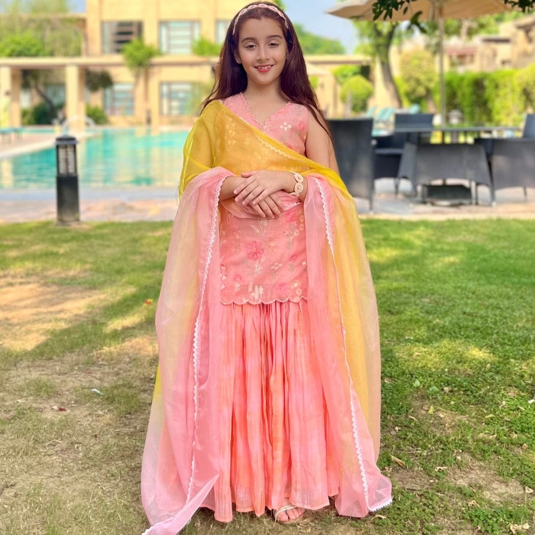 Traditional peach kids sharara suit – handcrafted wedding dress for girls in Saudi Arabia and Hyderabad.