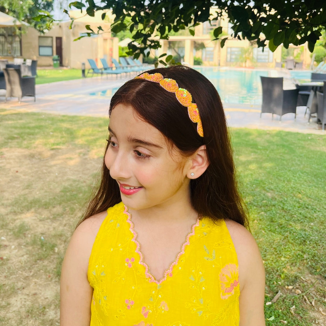 Girls yellow and orange sequined headpiece, perfect for lehengas and shararas in Mumbai Bandra celebrations.