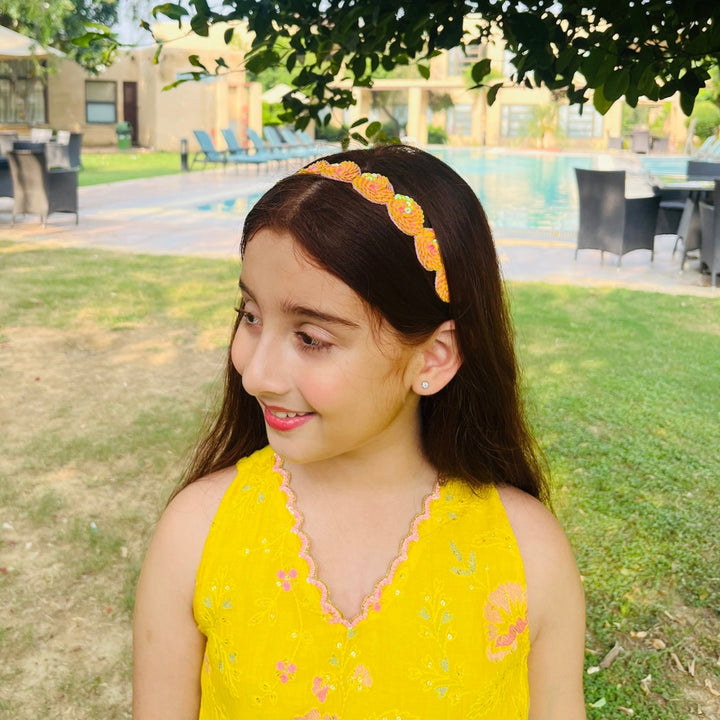 Girls yellow and orange sequined headpiece, perfect for lehengas and shararas in Mumbai Bandra celebrations.