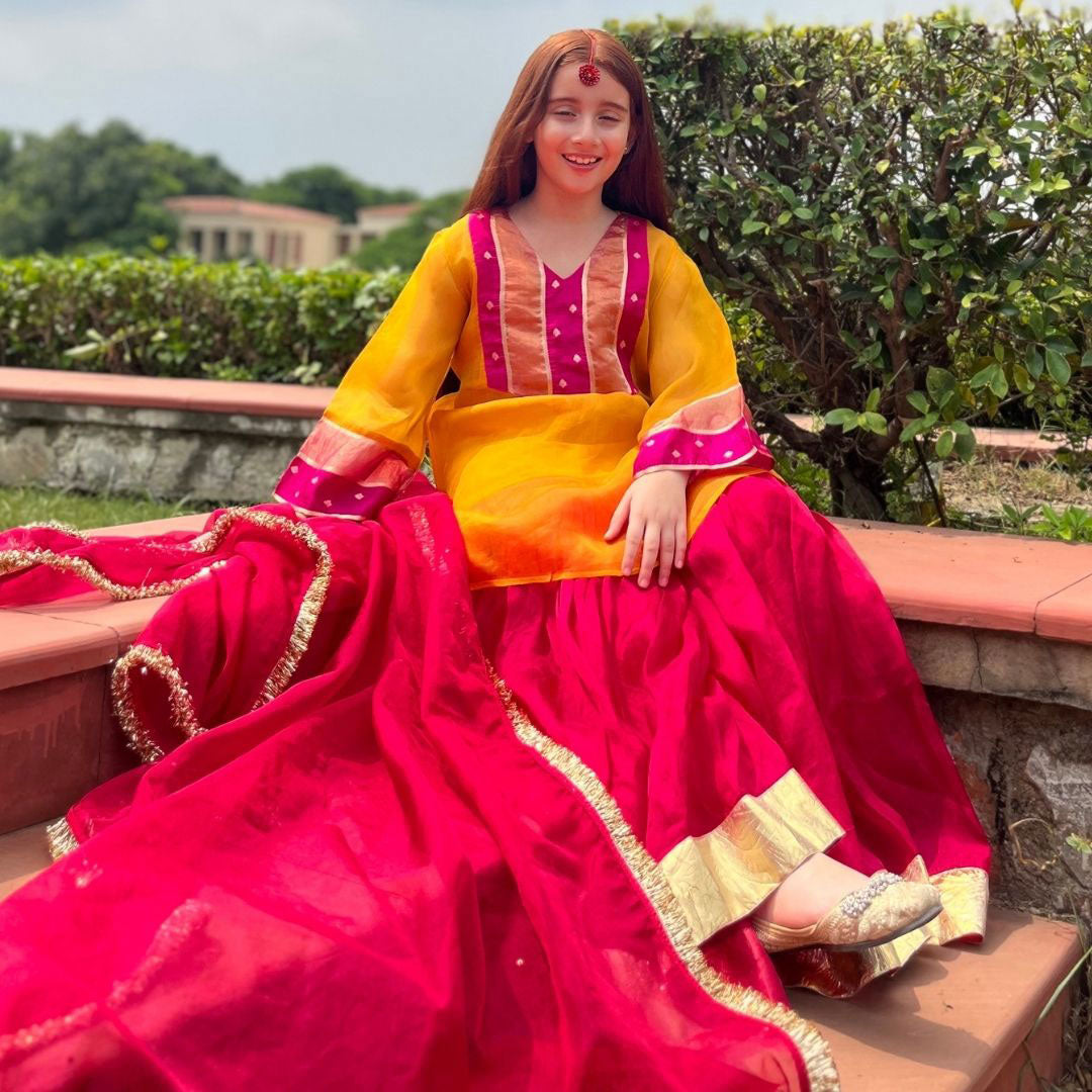 Mustard pink organza sharara seated view – luxury ethnic kidswear ages 1-14 for Haldi Navratri, Ahmedabad Bodakdev
