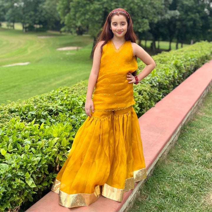 Misbah mustard sharara movement detail – premium ethnic kidswear ages 5-14 for Durga Puja Navratri, Ahmedabad Prahlad Nagar