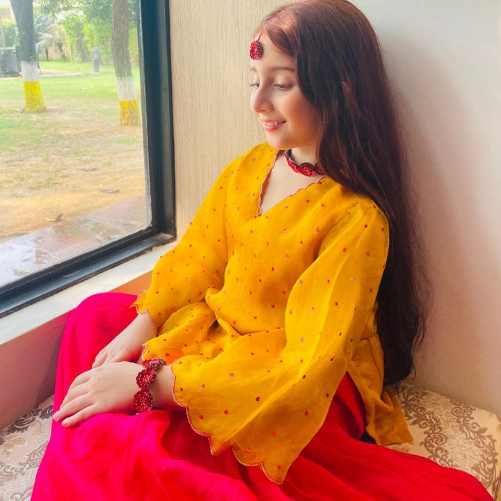 Elegant luxury kidswear sharara outfit in mustard and pink for weddings in Telangana